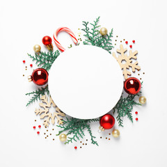 Flat lay composition with Christmas decor and blank card on white background. Space for text