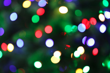 Abstract background with blurred colorful Christmas lights, bokeh effect