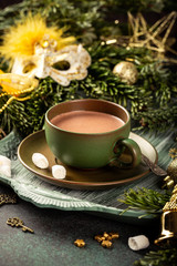 Obraz na płótnie Canvas Christmas greeting card with hot chocolate milk drink and festive decoration. Holiday concept with copy space.