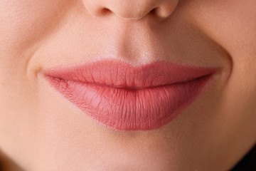 Obraz premium Perfect natural lip makeup. Close up macro photo with beautiful female mouth. Plump full lips. Close-up face detail. Perfect clean skin, light fresh lip make-up. Beautiful spa tender lip