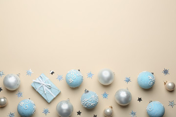 Flat lay composition with Christmas decorations on beige background, space for text. Winter season