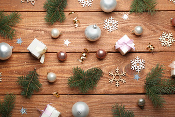 Flat lay composition with Christmas decorations on wooden background. Winter season