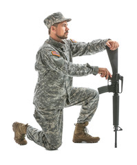 Soldier with assault rifle on white background