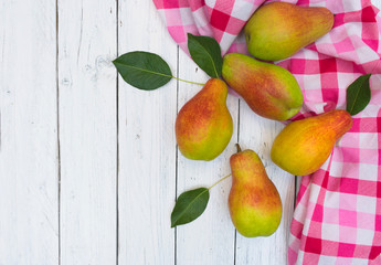 Pears on a white wooden background. Top view. Copy space.