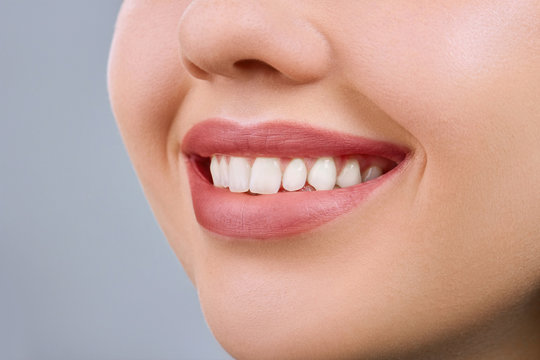 Beautiful smile young woman. White teeth. Dental health.Copy space.