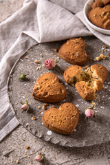 Biscuit hearts. Crispy and crumbly delicious cookies with natural ingredients: flour, nuts, seeds, pieces of chocolate, cocoa, fruit jams. Spring flower still life