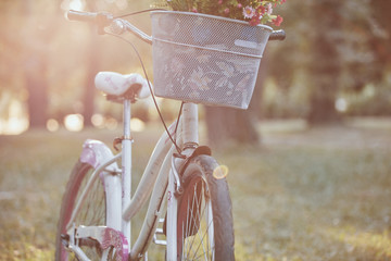 Retro bicycle with a basket full of flowers.