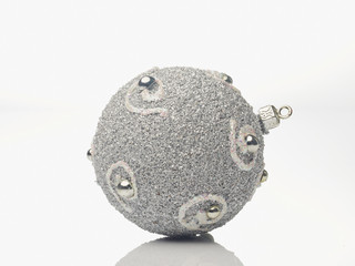 Silver christmas bauble on white