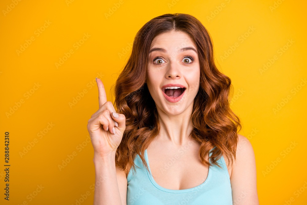 Poster Photo of charming casual cute nice beautiful attractive pretty sweet lovely trendy white girlfriend wearing turquoise singlet pointing up after realizing while isolated over yellow background