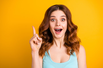 Photo of charming casual cute nice beautiful attractive pretty sweet lovely trendy white girlfriend wearing turquoise singlet pointing up after realizing while isolated over yellow background - obrazy, fototapety, plakaty
