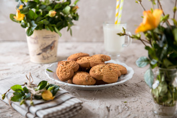 Biscuit hearts. Crispy and crumbly delicious cookies with natural ingredients: flour, nuts, seeds, pieces of chocolate, cocoa, fruit jams. Spring flower still life