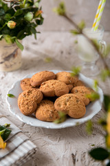 Biscuit hearts. Crispy and crumbly delicious cookies with natural ingredients: flour, nuts, seeds, pieces of chocolate, cocoa, fruit jams. Spring flower still life