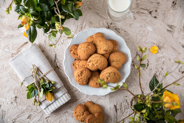 Biscuit hearts. Crispy and crumbly delicious cookies with natural ingredients: flour, nuts, seeds, pieces of chocolate, cocoa, fruit jams. Spring flower still life