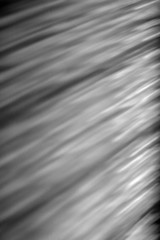 Black and white image of light reflected on a wall
