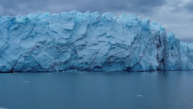 Passing by the enourmous walls of Perito Moreno Glacier in Patagonia, Argentina