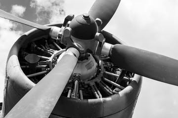 Propeller and engine of the old Soviet biplane. Black and white photo