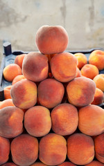 organic and fresh peaches at the market