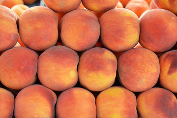 organic and fresh peaches at the market