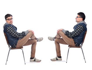 man sitting on a chair in white background