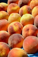 organic and fresh peaches at the market