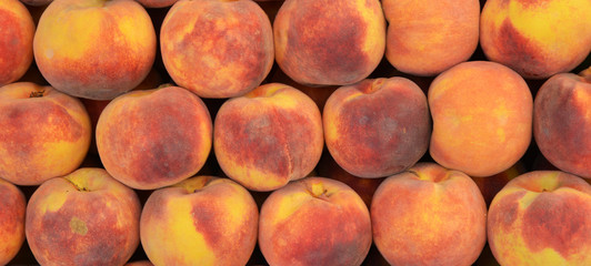 organic and fresh peaches at the market