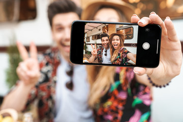 Close up of a couple sitting at the trailer outdoors