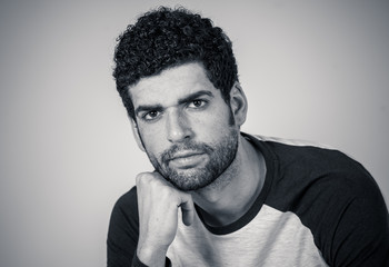 Handsome angry young man with furious face looking disgusted. Human expressions and emotions