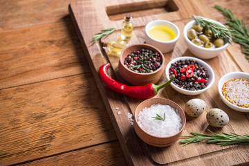 Fresh salad ingredients (salt, pepper, olive, tomato, rosemary, oil )