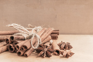 Cinnamon sticks close up on rustic background. Christmas time.