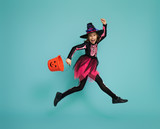 little witch on turquoise background