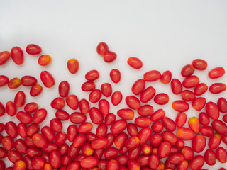 Fresh cherry tomatoes on white background