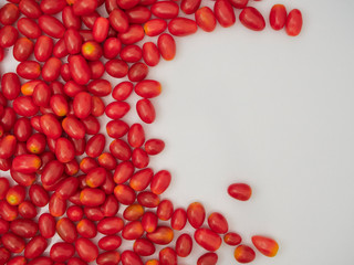 Fresh cherry tomatoes on white background