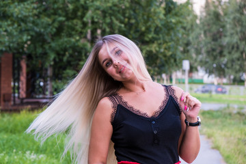 Naklejka premium Portrait of a natural beauty girl with long blonde hair. Hair care concept.