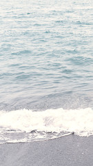 Sea or ocean water with little relaxing waves and reflection. Beautiful gradient with beige and blue colors. Neutral background and texture.