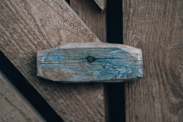 Wooden door lock. Door bolt. Hardware. Old door wooden heck