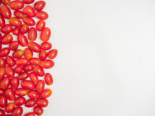 Fresh cherry tomatoes on white background