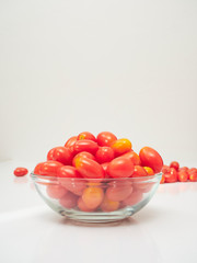 Fresh tomatoes in a glass bowl