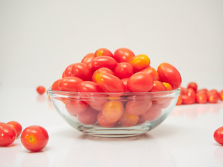 Fresh tomatoes in a glass bowl
