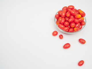 Fresh tomatoes in a glass bowl