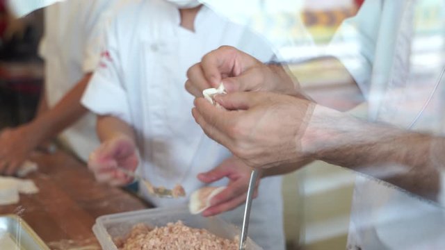 Cooking Video Steps to make Xiao long bao.It is the most popular Chinese dim sum dishes. Xiao long bao is made from bread flour mixed with wheat flour with minced pork filled with broth in the water.