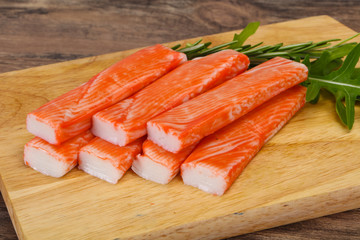 Crab stick surimi over board