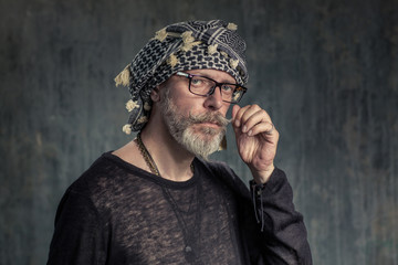 Old fashion man, good looking. Hottabych twists mustache