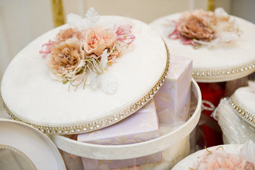 large bright round gift boxes with transparent walls with slightly open lids, close up