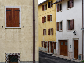 Fototapeta na wymiar windows and doors of a building in a mountain village of Italy