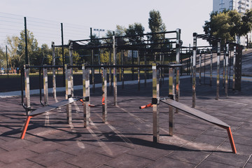 Modern outdoor gym in the residential area. Outdoor exercise equipment for workout. Sports ground.