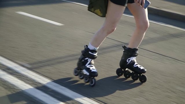 Girl riding on rollers on the track.