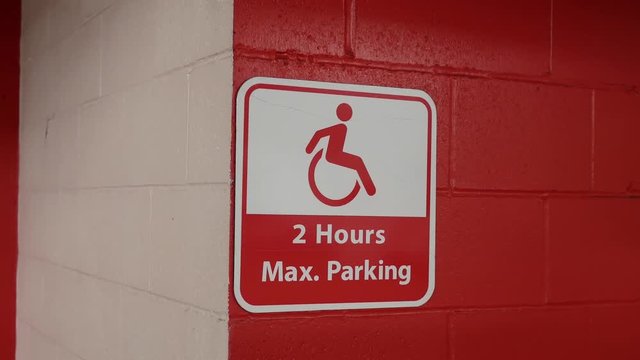 Motion of red two hours maximum parking sign on wall with 4k resolution