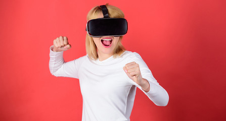 Woman using virtual reality headset. Portrait of woman in a white blouse with virtual reality...