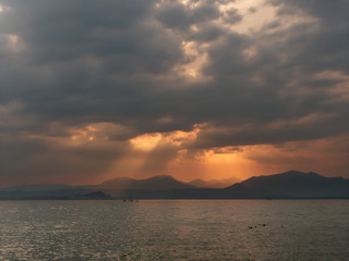 Naklejka na ściany i meble Beautiful sunset over Lake Garda in Italy