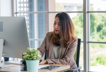 Young asian businesswoman working on computer at office.concentrated at work